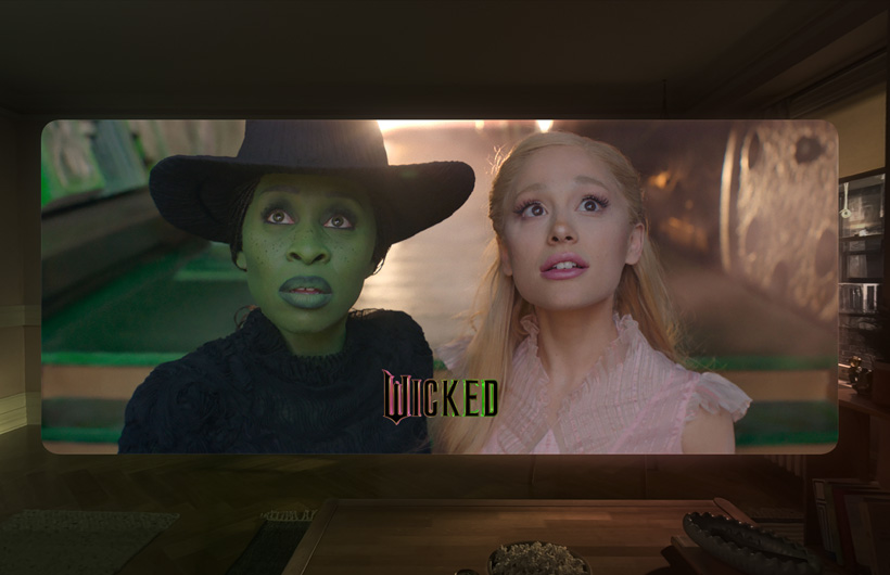 Two characters from the film Wicked in the Apple TV app on Apple Vision Pro