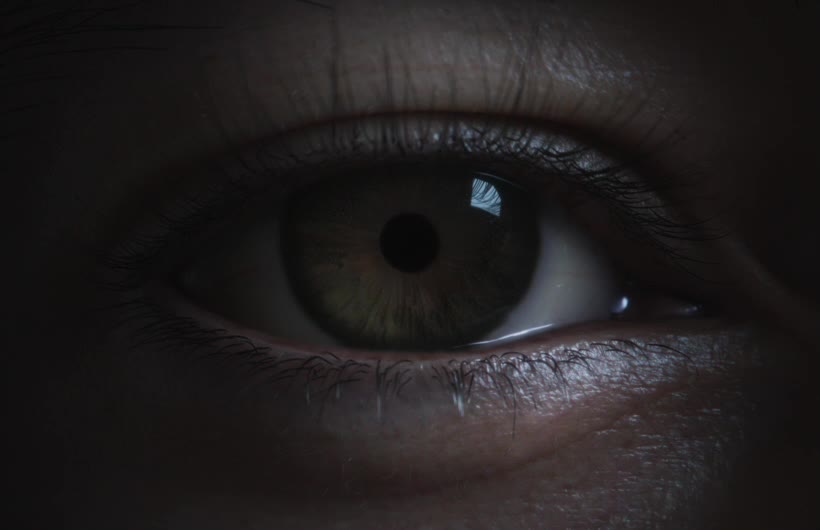Extreme close-up of a person's eye, representing Optic ID authentication on Apple Vision Pro